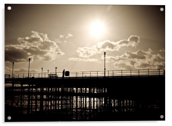 Sepia image of part of Southend Pier shot against the sun, with silhouette of structure and a man on the walkway. Southrnd on Sea, Essex. Acrylic by Peter Bolton