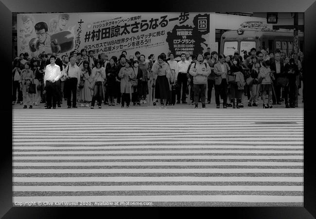 The man in the white shirt. Shibuya crossing Tokyo Framed Print by Clive Karl Wuest