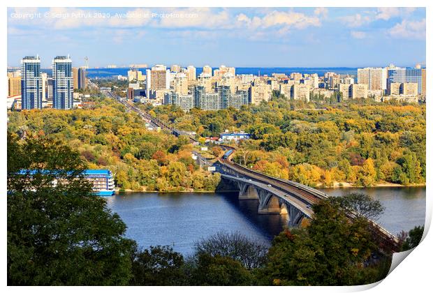 Landscape of the autumn city of Kyiv with a view of the Dnipro River, a branch and a subway bridge, Hydropark and the left bank of the Rusanovka district. Print by Sergii Petruk
