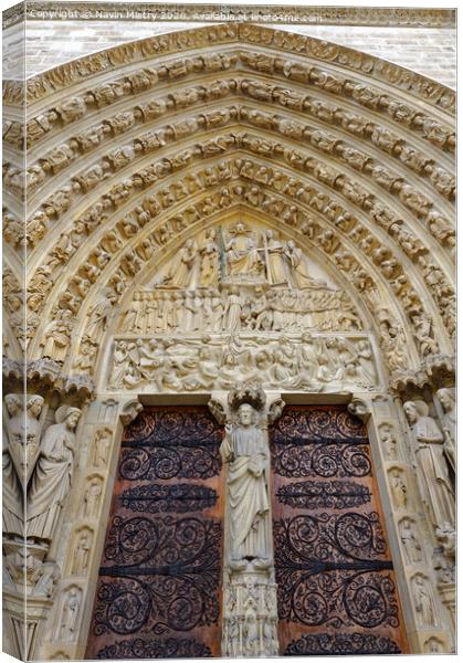 The ornate doorway of Notre Dame Cathedral, Paris, France Canvas Print by Navin Mistry