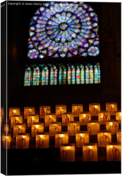 Candles inside Notre Dame Cathedral Paris Canvas Print by Navin Mistry