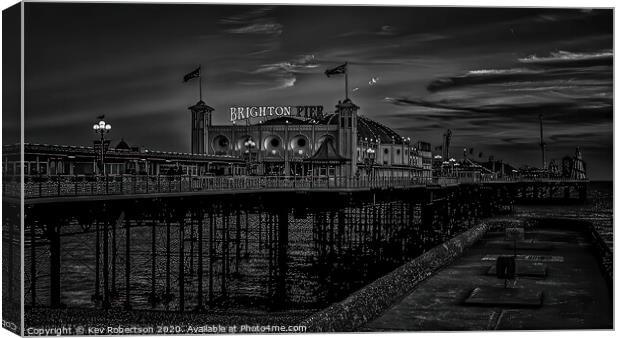 Brighton Pier at night Canvas Print by Kev Robertson