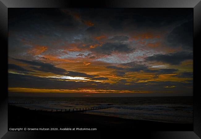 A black, orange and blue sunrise Framed Print by Graeme Hutson