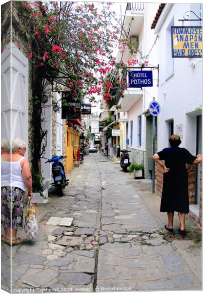 Back street in Skiathos town at Skiathos Island in Greece. Canvas Print by john hill