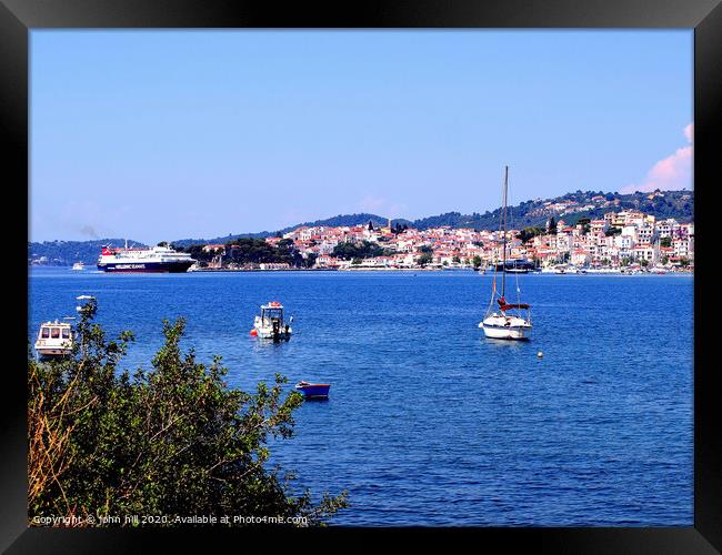 Skiathos town from across the bay on Skiathos Island in Greece. Framed Print by john hill