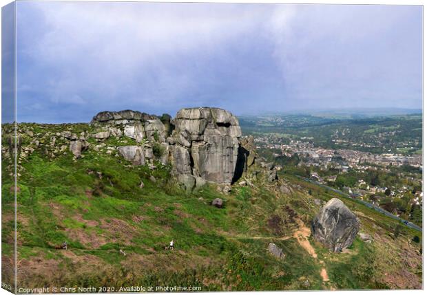 The Cow and Calf rocks and Ilkley town. Canvas Print by Chris North