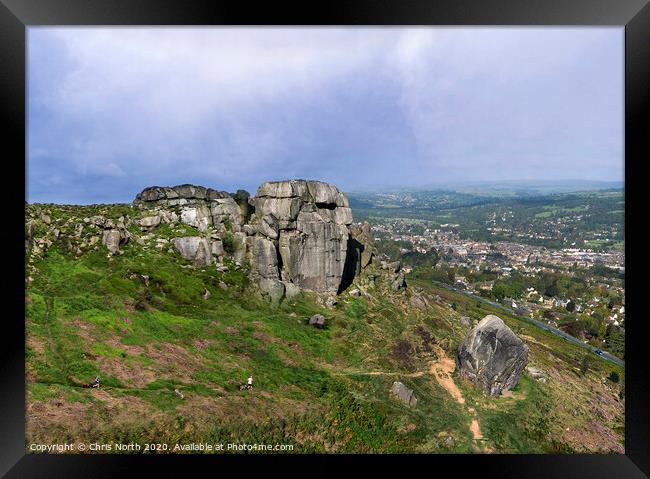 The Cow and Calf rocks and Ilkley town. Framed Print by Chris North