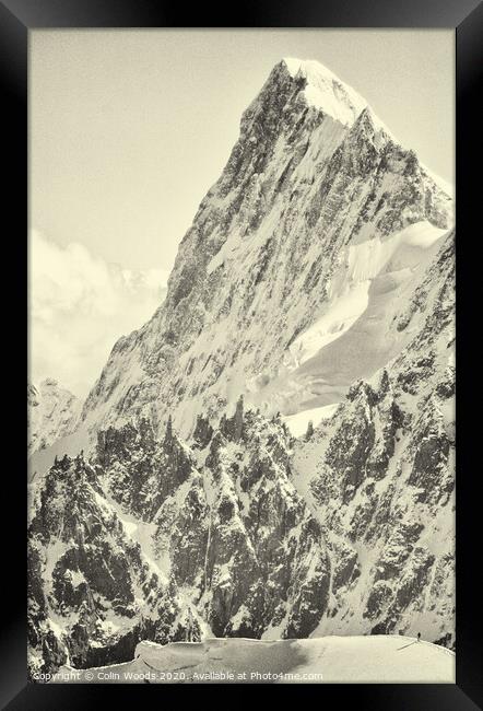 The tiny figure of a climber in front  of the Grandes Jorasses Framed Print by Colin Woods