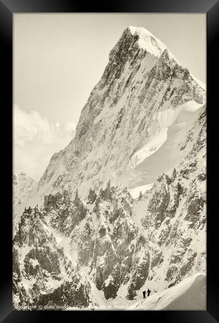 The tiny figure of a climber in front  of the Grandes Jorasses Framed Print by Colin Woods