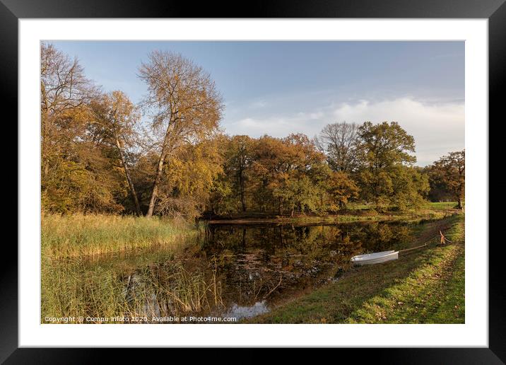two boats in a pond with autumn colors Framed Mounted Print by Chris Willemsen