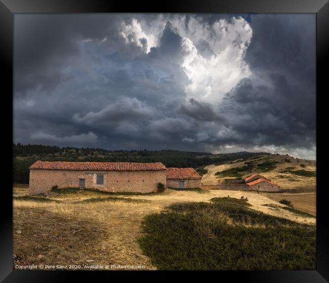 Dramatic Stormy Clouds over Abandoned Rural Houses Framed Print by Pere Sanz