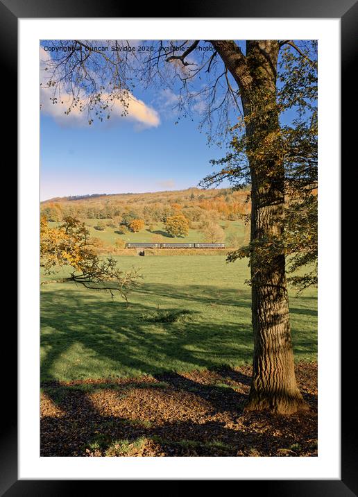Autumn sprinter train in the landscape Framed Mounted Print by Duncan Savidge