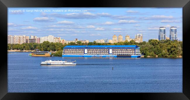 Landscape: pleasure ships go along the Dnipro River against the background of residential areas of Kyiv on the banks in bright sunlight. Framed Print by Sergii Petruk