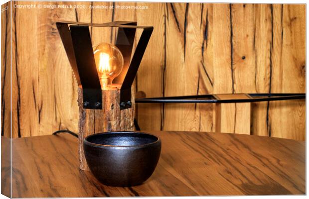 Beautiful warm still life of old wood in the form of a table lamp and a clay bowl. Canvas Print by Sergii Petruk