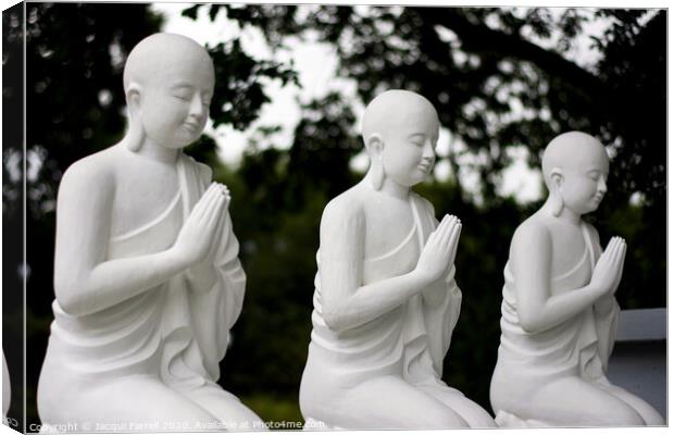 Praying Buddhist Statues  Canvas Print by Jacqui Farrell