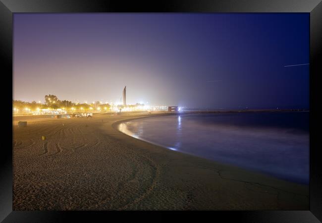 Icaria Beach in Barcelona at Night Framed Print by Artur Bogacki