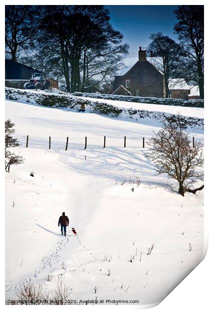One man and his dog, a winter walk. Print by Chris North