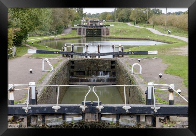 Row of lock gates at Stoke Bruene, Northamptonshir Framed Print by Clive Wells