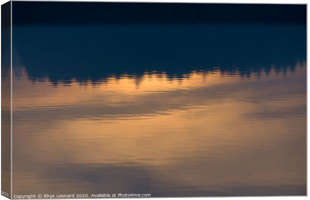Reflection of sunset colors over trees in calm rippled water Canvas Print by Rhys Leonard