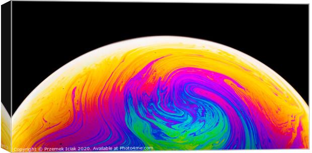Rainbow soap bubble on a dark background. Close-up of colorful surface. Canvas Print by Przemek Iciak