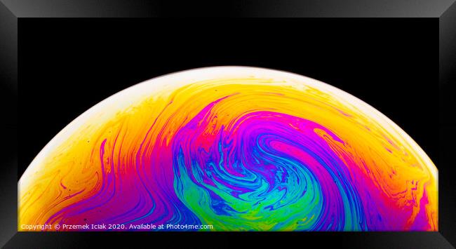 Rainbow soap bubble on a dark background. Close-up of colorful surface. Framed Print by Przemek Iciak