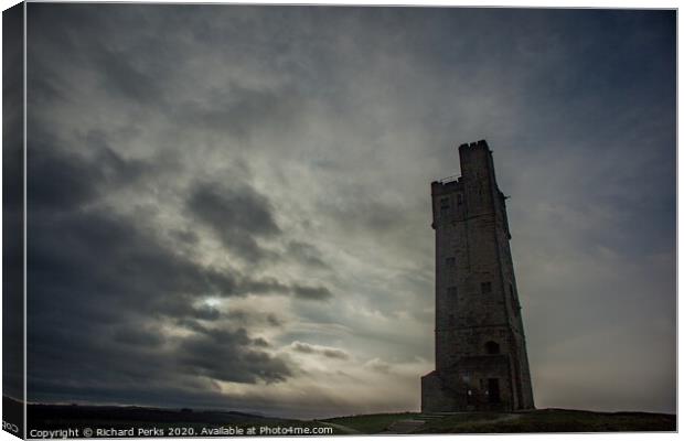 Majestic Castle Hill Tower Amidst Rolling Clouds Canvas Print by Richard Perks