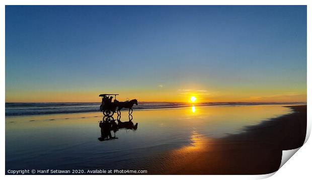 Silhouetted horse-drawn carriage beach sunset 1 Print by Hanif Setiawan