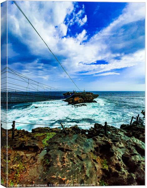 A rock plateau and a rock island in the sea 5 Canvas Print by Hanif Setiawan