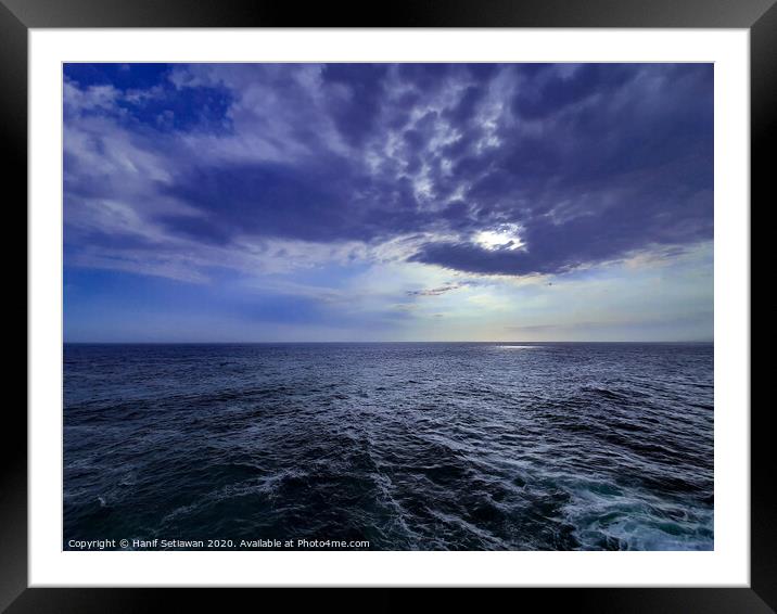 Wavy sea and dramatic cloud sky at sunset Framed Mounted Print by Hanif Setiawan