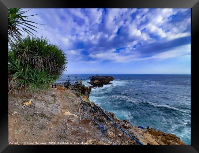 A rock plateau and a rock island in the sea 6 Framed Print by Hanif Setiawan