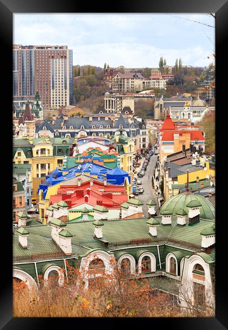 Landscape of an autumn city with a view of the restored roofs and buildings of Vozdvizhenka, the old district of Podil in the city of Kyiv. Framed Print by Sergii Petruk