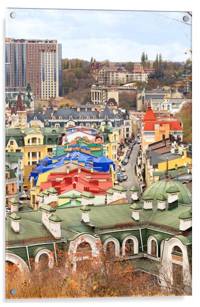 Landscape of an autumn city with a view of the restored roofs and buildings of Vozdvizhenka, the old district of Podil in the city of Kyiv. Acrylic by Sergii Petruk