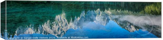 Mountains reflection on the lake  Canvas Print by Sergio Delle Vedove