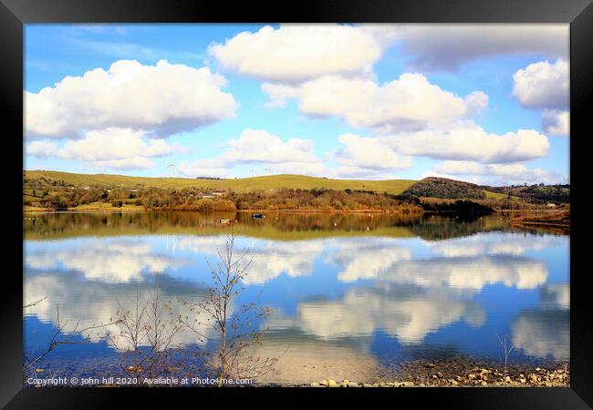Cloud reflections in Carsington Water in Derbyshire. Framed Print by john hill