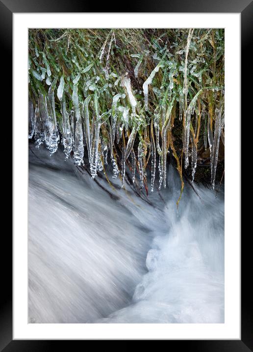 Icicles hanging over a moorland stream Framed Mounted Print by Andrew Kearton