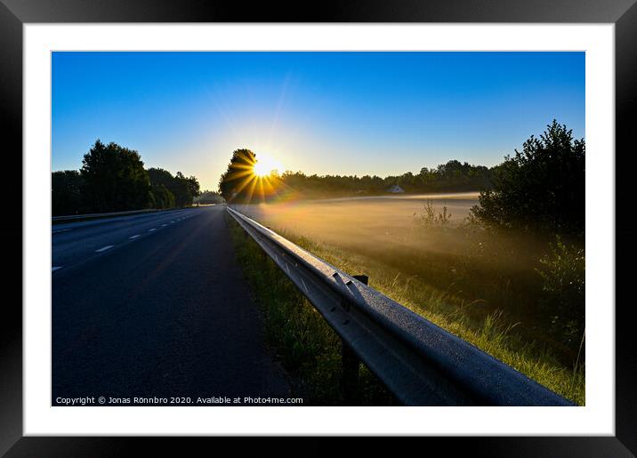 early sunrise over straight road with deminishing perspctive Framed Mounted Print by Jonas Rönnbro
