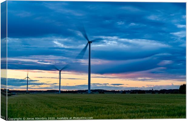 big windmills on field with dramatic sky Canvas Print by Jonas Rönnbro