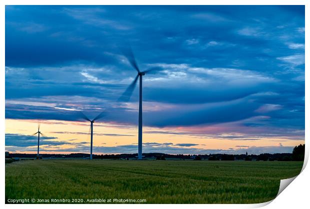 big windmills on field with dramatic sky Print by Jonas Rönnbro