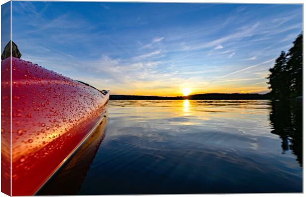 red plastic kayak on calm water in the sunset Canvas Print by Jonas Rönnbro