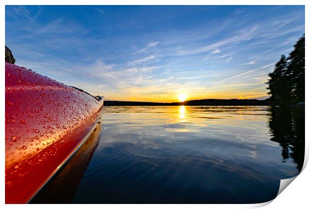 red plastic kayak on calm water in the sunset Print by Jonas Rönnbro