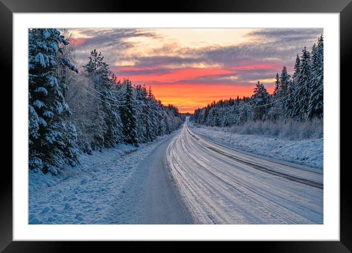 winter road in Varmland Sweden and orange sunrise Framed Mounted Print by Jonas Rönnbro