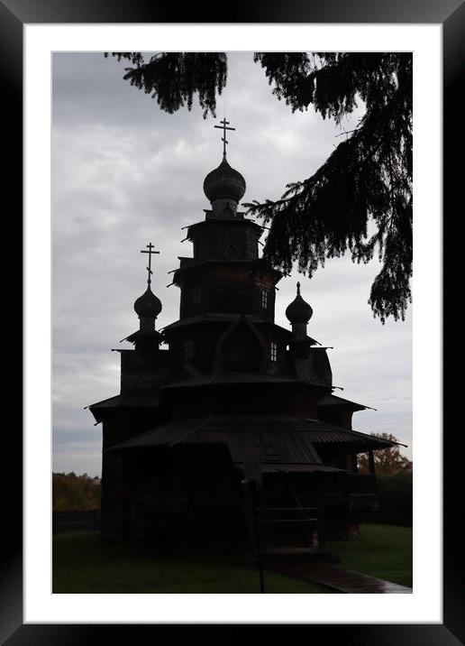 Beautiful wooden brown Christian old Church on a r Framed Mounted Print by Karina Osipova