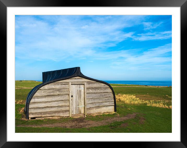 Lindisfarne Boat Shed. Framed Mounted Print by Tommy Dickson