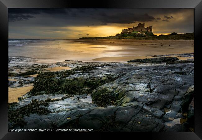 Majestic Bamburgh Castle overlooking the North Sea Framed Print by richard sayer
