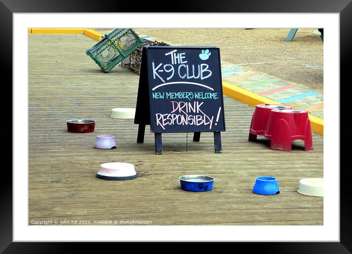 The K-9 club outside a cafe at Wells next the Sea in Norfolk.. Framed Mounted Print by john hill