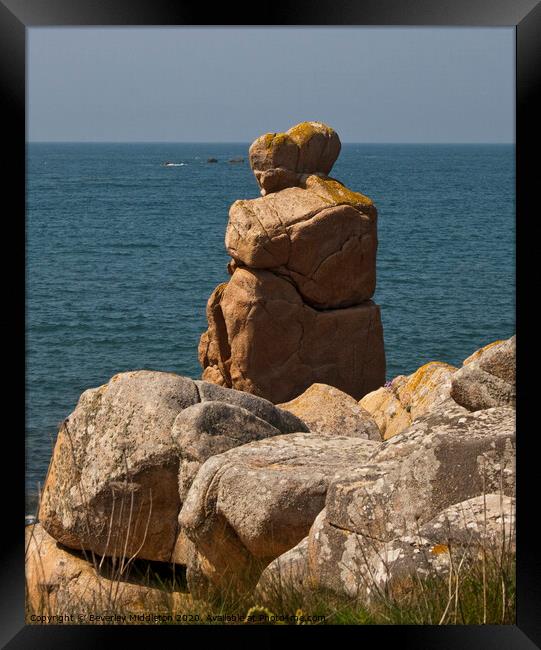 Granite couple looking out to sea on Brittanys pink granite coast, France Framed Print by Beverley Middleton