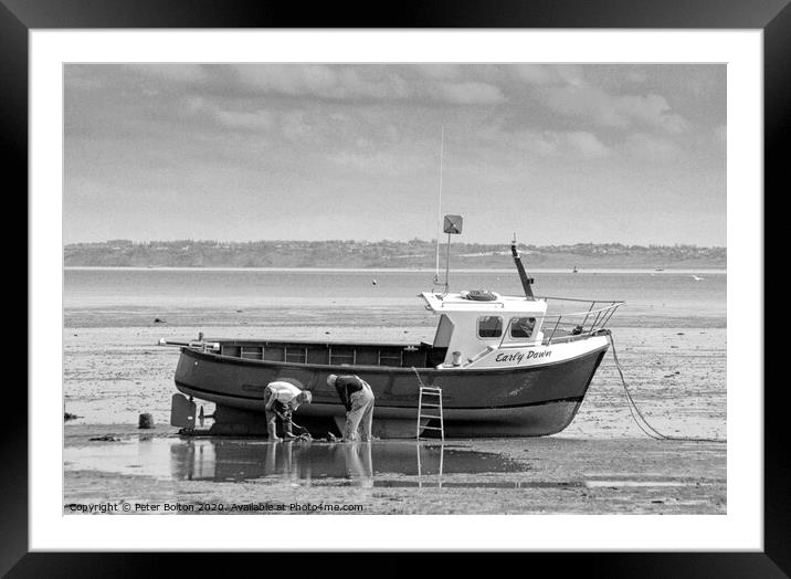 Fishermen maintain their boat at low tide at Thorpe Bay, Essex, UK. Framed Mounted Print by Peter Bolton