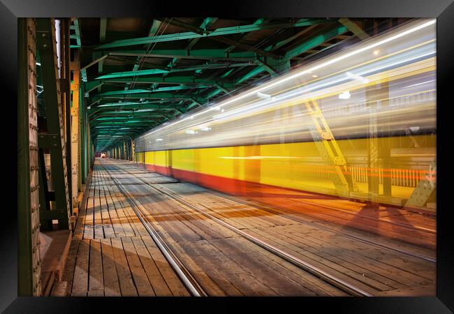 Bridge With Tram Light Trails In Warsaw Framed Print by Artur Bogacki