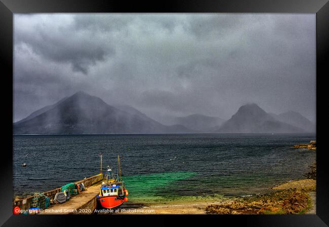 A shower of rain crosses the Black Cuillin Range viewed from Elgol pier. Framed Print by Richard Smith