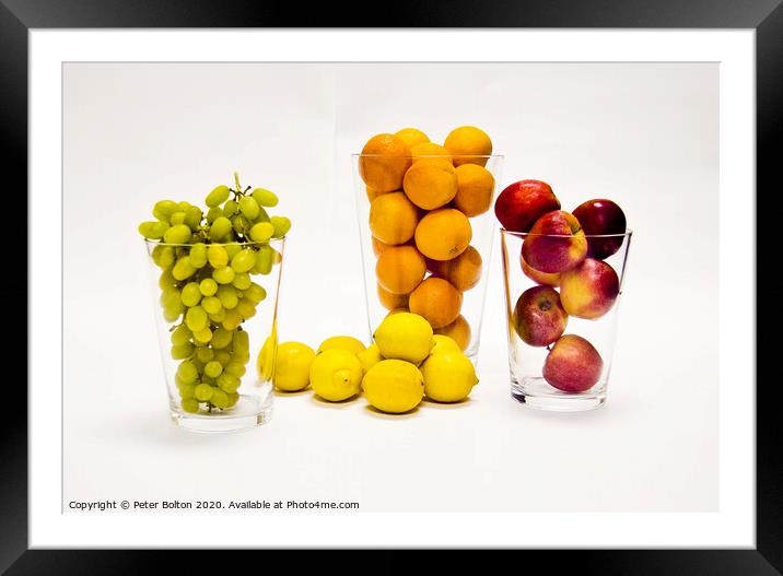 Still life of fresh fruits arranged as graphic design on a white background Framed Mounted Print by Peter Bolton